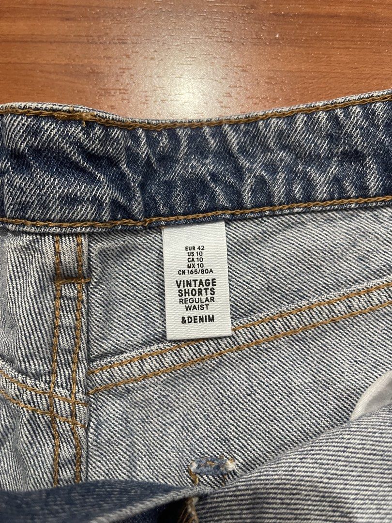 H&M Vintage Denim Shorts (Category: Shorts) located in Cainta. Submitted by engelerrrr (Listing ID 1422967019, Image 2). Description: - H&M vintage denim shorts - Regular waist - Distressed detailing and raw hem - Light blue wash - Size: EUR 42 / US 10 / MX 10 - Features: Two front pockets, two back pockets.