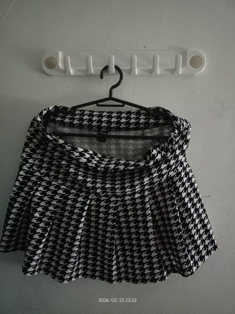 Houndstooth Cropped Blazer and Skirt Set (Category: Sets or Coordinates) located in Manila. Submitted by airapreloved091826 (Listing ID 1423054489, Image 2). Description: - Houndstooth cropped blazer and skirt set - Blazer: Double-breasted design - Skirt: Pleated style - Color: Black and white houndstooth - Perfect for a coordinated look - Suitable for various occasions.