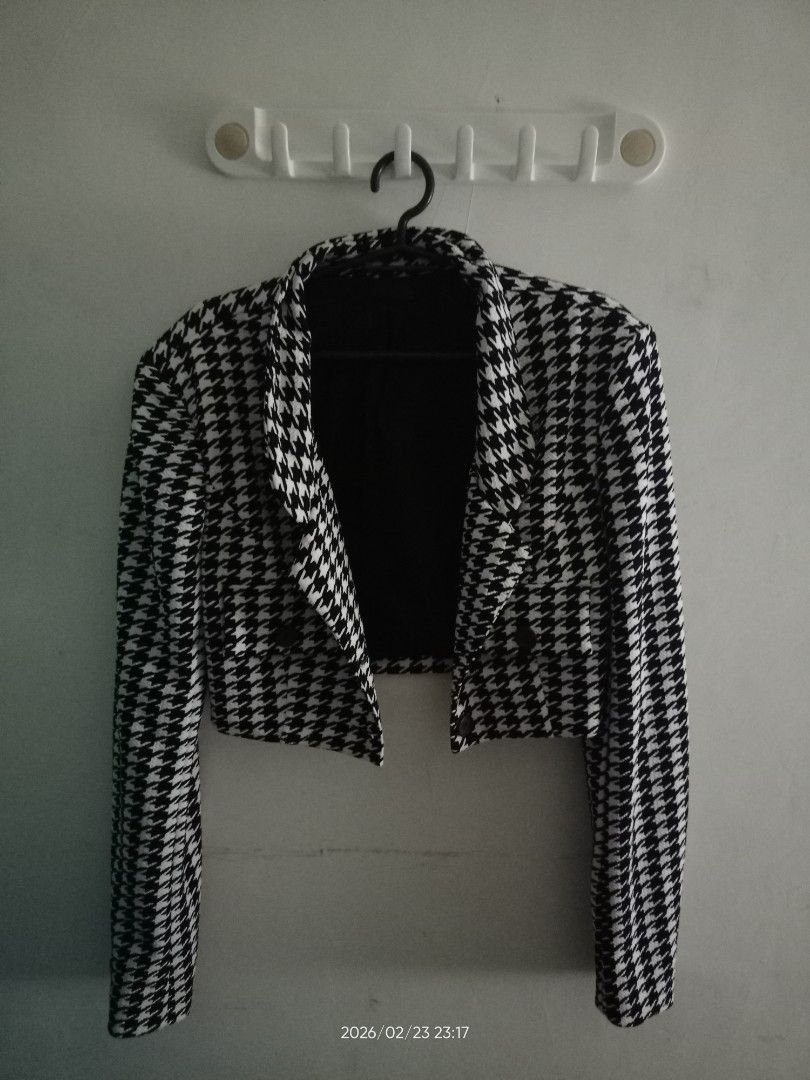 Houndstooth Cropped Blazer and Skirt Set (Category: Sets or Coordinates) located in Manila. Submitted by airapreloved091826 (Listing ID 1423054489, Image 1). Description: - Houndstooth cropped blazer and skirt set - Blazer: Double-breasted design - Skirt: Pleated style - Color: Black and white houndstooth - Perfect for a coordinated look - Suitable for various occasions.