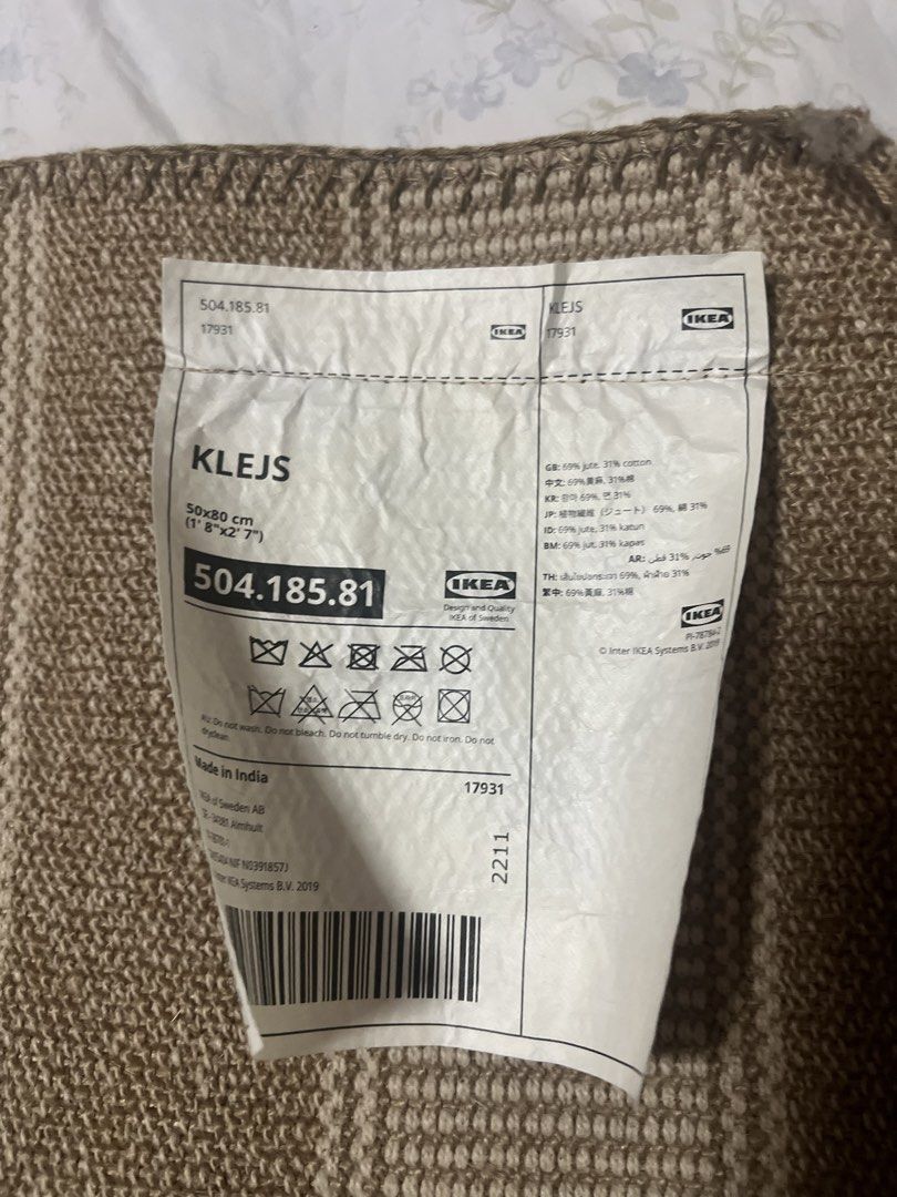 IKEA KLEJS Rug (Category: Carpets, Mats & Flooring) located in San Juan City. Submitted by iambernie (Listing ID 1422997667, Image 2). Description: - IKEA KLEJS rug - Striped pattern: Brown and beige - Size: Approximately 50cm x 80cm - Material: Jute and cotton - Origin: Made in India - Care instructions on tag - Suitable for various spaces - Never used, just kept in cabinet .
