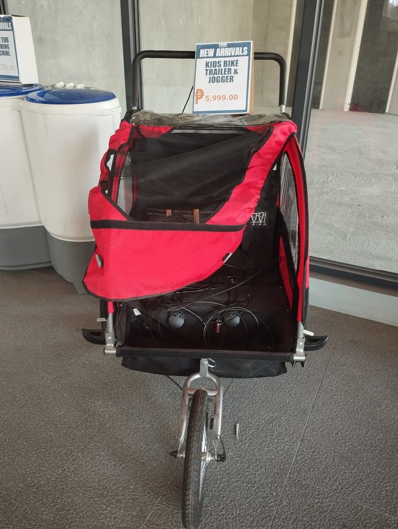 Kids Bike Trailer & Jogger (Category: Bicycles) located in Caloocan City. Submitted by dhiony (Listing ID 1422909764, Image 1). Description: - New arrival: Kids bike trailer and jogger - Red and black canopy - Mesh window - Single front wheel - Black storage area.