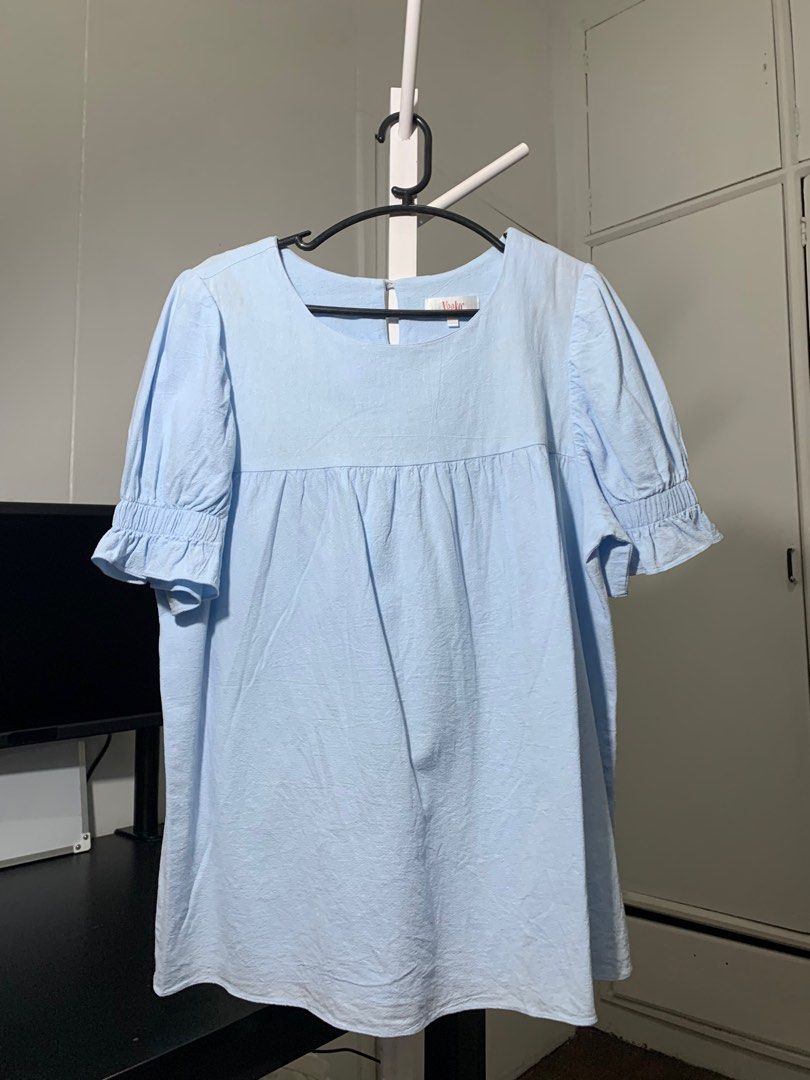 Light Blue Puff Sleeve Blouse (Category: Blouses) located in Quezon City. Submitted by declutterwithm (Listing ID 1423018757, Image 1). Description: - Light blue blouse - Square neckline - Short puff sleeves with ruffled cuffs - Gathered detail below neckline - Textured fabric.