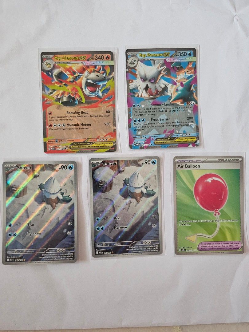 Mega Evolution Cards (Category: Raw Cards) located in Singapore. Submitted by _lezi_ (Listing ID 1423081245, Image 1). Description: - Pokemon card collection for sale. - Includes: - M Charizard EX - M Abomasnow EX - Snover - Air Balloon - Cards have been kept in sleeves..