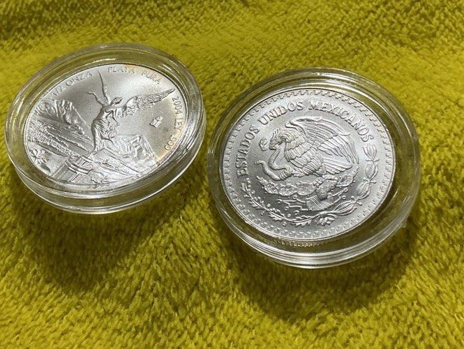 Mex “1/2 oz” Silver Libertad (Category: Currency) located in Del Monte. Submitted by bernapi63 (Listing ID 1422988552, Image 2). Description: - Two Mexican Silver Libertad coins years each “2004 and 2010” 1/2 oz each (15.5!grams each weight at .999 fineness) Plata Pura - Includes protective cases - Coin 1: Winged figure design - Coin 2: Eagle with snake design - Ideal for collectors and precious metal enthusiasts -Cost for 1 pc only - in protecti