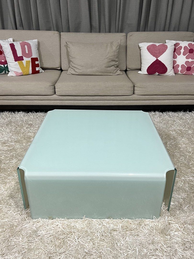 Modern Square Glass Coffee Table (Category: Tables & Sets) located in Makati City. Submitted by curatedfindsbydei (Listing ID 1422915336, Image 2). Description: Originally P15,000, now selling for P7,500 only. Colors available: White and black. Measurements: 80 x 80 x 30cm. Stylish square coffee table with a unique, curved design. Perfect for living rooms, offering a modern and minimalist aesthetic. Its clean lines and color make it a versatile p