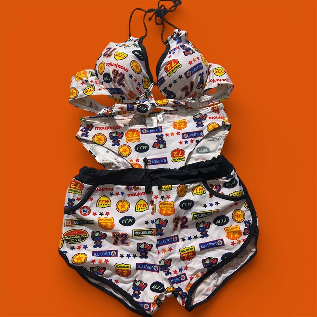 Moujonjon Swimsuit Set (Category: Bikinis & Swimsuits) located in Manila. Submitted by AngelResty (Listing ID 1423006840, Image 2). Description: - Moujonjon swimsuit set includes: - Bikini top (halter neck) - Bikini bottoms - Shorts (black trim, drawstring) - White base with colorful graphics and "72". - Made of swimwear material..