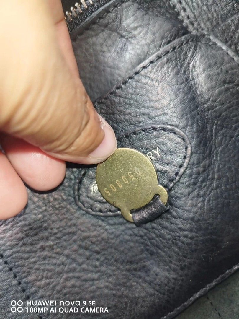 Mulberry Bayswater Black Leather Handbag (Category: Luxury Bags & Wallets) located in Cebu City. Submitted by tlisurplus (Listing ID 1422947486, Image 3). Description: - Authentic Mulberry Bayswater handbag - Black leather - Signature postman's lock closure - Detachable clochette with keys - Interior zipped and slip pockets - Made in England - Classic grain texture - Spacious interior.