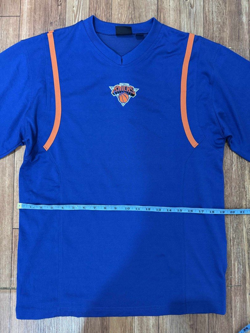 NBA New York Knicks Jersey (Category: Activewear) located in Quezon City. Submitted by thrifttogreatness (Listing ID 1422913316, Image 3). Description: - Authentic NBA New York Knicks jersey - Features a blue base with orange accents - Includes the Knicks logo on the chest - NBA logo on the sleeve - Classic V-neck design - Size: S - Made in Korea.