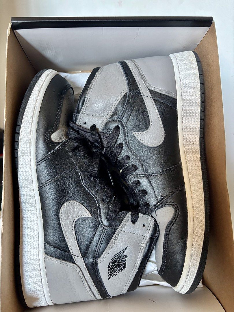 Nike Air Jordan 1 Retro High OG Shadow (Category: Sneakers) located in Las Pinas. Submitted by dthreeonlineshop (Listing ID 1422925406, Image 1). Description: - Nike Air Jordan 1 Retro High OG 'Shadow' sneakers - Black and grey color scheme - Features the iconic Nike swoosh - Black laces and white midsole - Air Jordan wings logo on the ankle - Size tag visible inside - Made in China.