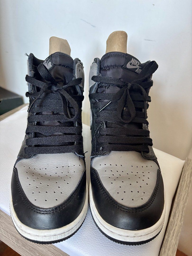 Nike Air Jordan 1 Retro High OG Shadow (Category: Sneakers) located in Las Pinas. Submitted by dthreeonlineshop (Listing ID 1422925406, Image 2). Description: - Nike Air Jordan 1 Retro High OG 'Shadow' sneakers - Black and grey color scheme - Features the iconic Nike swoosh - Black laces and white midsole - Air Jordan wings logo on the ankle - Size tag visible inside - Made in China.
