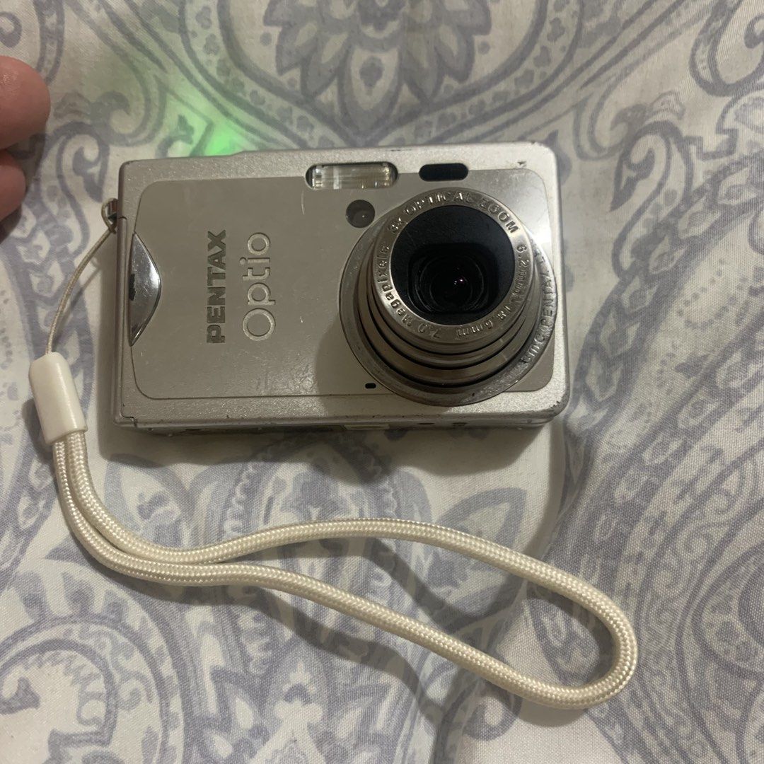 Pentax Optio S7 Digital Camera (Category: Cameras) located in Lipa City. Submitted by zio_3 (Listing ID 1422977462, Image 3). Description: Working digicam but needs repair Inclusion - Unit - Strap - Battery (bought sa Laz) - Universal Charger Cosmetics - 6/10 Issue: Sensor — Minsan wala sa focus — Sometimes there are lines sa photo.