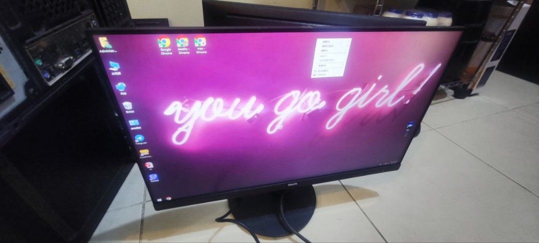 Philips Monitor (Category: Monitor Screens) located in Makati City. Submitted by ghael (Listing ID 1422986958, Image 2). Description: - Philips monitor with black stand. - Screen displays a purple background with "you go girl!". - Shows various application icons. - Includes power cable..