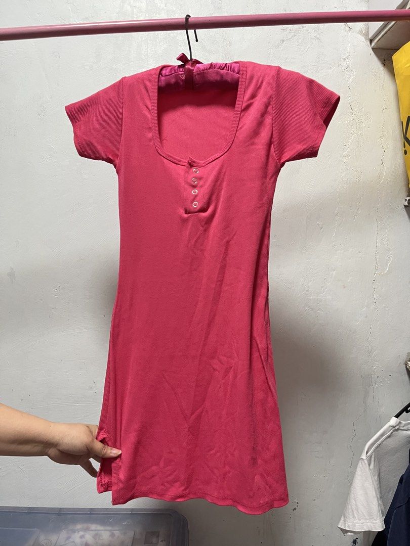 Pink Henley Dress (Category: Dresses) located in Manila. Submitted by declutter_w_sam (Listing ID 1423032007, Image 1). Description: - Pink dress - Henley neckline with three buttons - Short sleeves - Slightly flared skirt - Made of soft, comfortable fabric - Currently on a hanger.