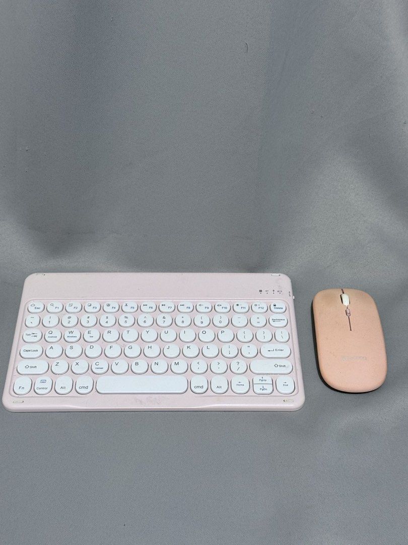 Pink Wireless Keyboard and Mouse Set (Category: Computer Keyboard) located in Mansalay. Submitted by declutterandco (Listing ID 1422909492, Image 1). Description: RFS: wanna upgrade:)) - Pink wireless keyboard and mouse combo - Compact keyboard layout with white keys - Simple, matching pink mouse - Designed for portability - Ideal for use with tablets and laptops.
