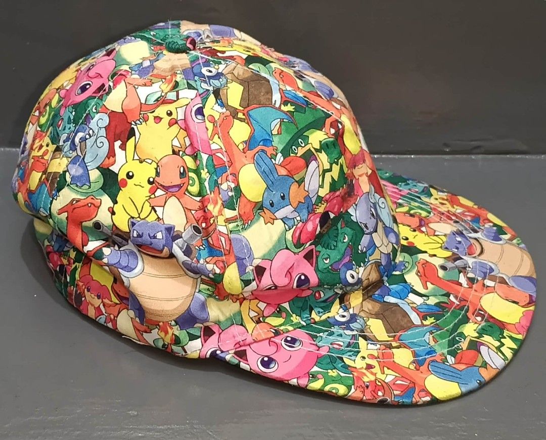Pokemon All-Over Print Cap (Category: Babies & Kids Fashion) located in Pasig City. Submitted by joaquin_1207 (Listing ID 1423056818, Image 3). Description: Cap features an all-over print of various Pokemon characters. It has a curved brim and a white interior. The cap is made of 100% polyester. The cap is colorful and eye-catching, perfect for Pokemon fans..