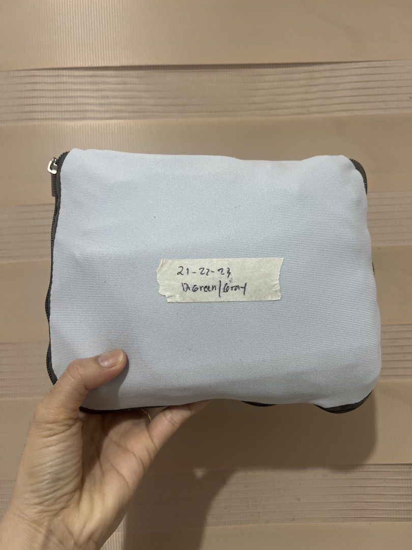 Gray Luggage Cover - Gray (Category: Luggage) located in Ajuy. Submitted by wisecloud_badac1 (Listing ID 1423024154, Image 1). Description: - Green and gray pouch - Zipper closure for secure storage - Features a date label: 21-22-23.