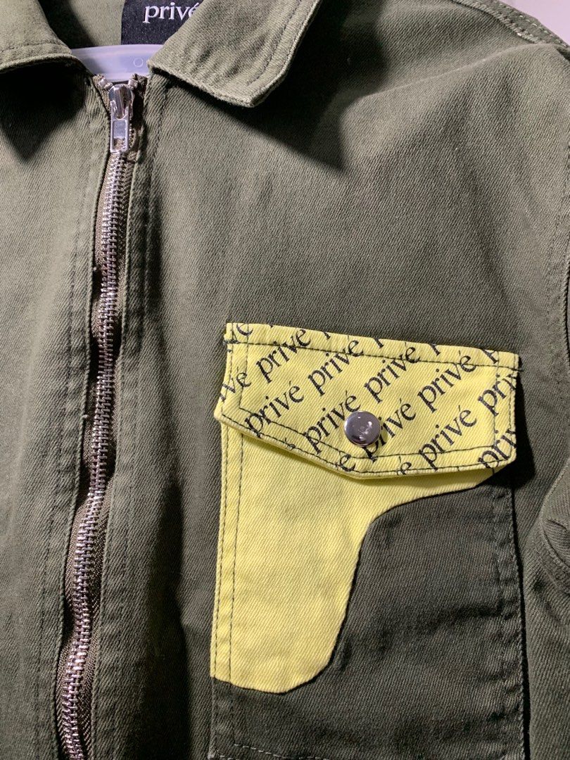 Privé Olive Green Jacket (Category: Coats, Jackets and Outerwear) located in Quezon City. Submitted by declutterwithm (Listing ID 1423020313, Image 3). Description: - Olive green Privé Alliance jacket - Size: Medium - Full-length zipper - Unique pocket design with yellow accent - Privé branding - Collared neckline - Long sleeves .