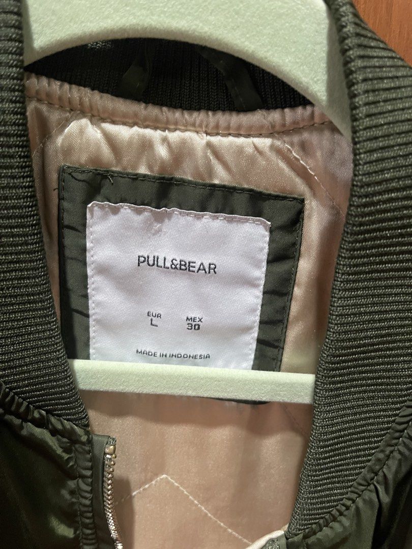Pull&Bear Bomber Jacket - Green (Category: Coats, Jackets and Outerwear) located in Cainta. Submitted by engelerrrr (Listing ID 1422967230, Image 2). Description: - Pull&Bear bomber jacket - Size: L - Color: Green - Features: Ribbed collar, cuffs, and hem; zip closure; pockets - Made in Indonesia - Stylish and versatile - Perfect for layering.