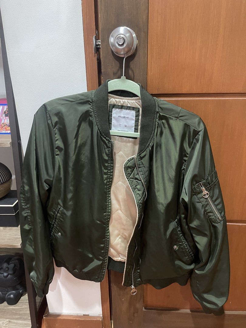 Pull&Bear Bomber Jacket - Green (Category: Coats, Jackets and Outerwear) located in Cainta. Submitted by engelerrrr (Listing ID 1422967230, Image 1). Description: - Pull&Bear bomber jacket - Size: L - Color: Green - Features: Ribbed collar, cuffs, and hem; zip closure; pockets - Made in Indonesia - Stylish and versatile - Perfect for layering.