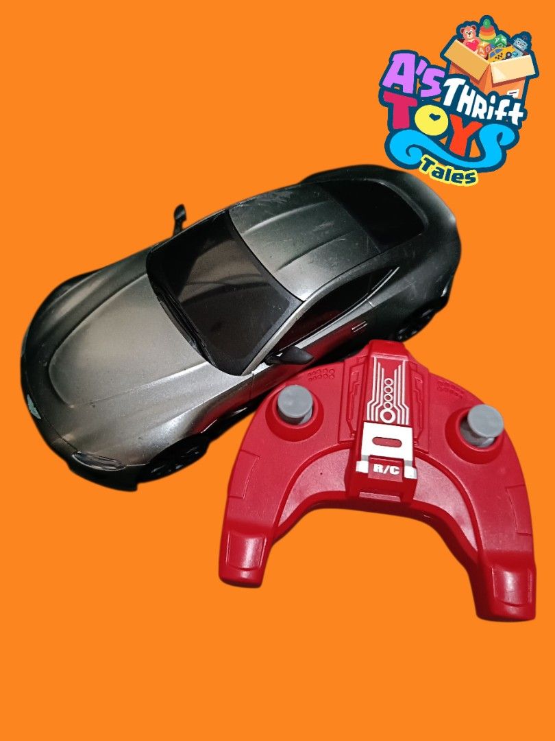 RC Car Assortment sold per piece (Category: Remote Control Toys) located in Iligan City. Submitted by shehabdor98515 (Listing ID 1423077490, Image 3). Description: - RC car collection - Available colors: black, silver, red, and orange stripe designs - Each car includes a remote control - Some remotes are branded "CMJ".