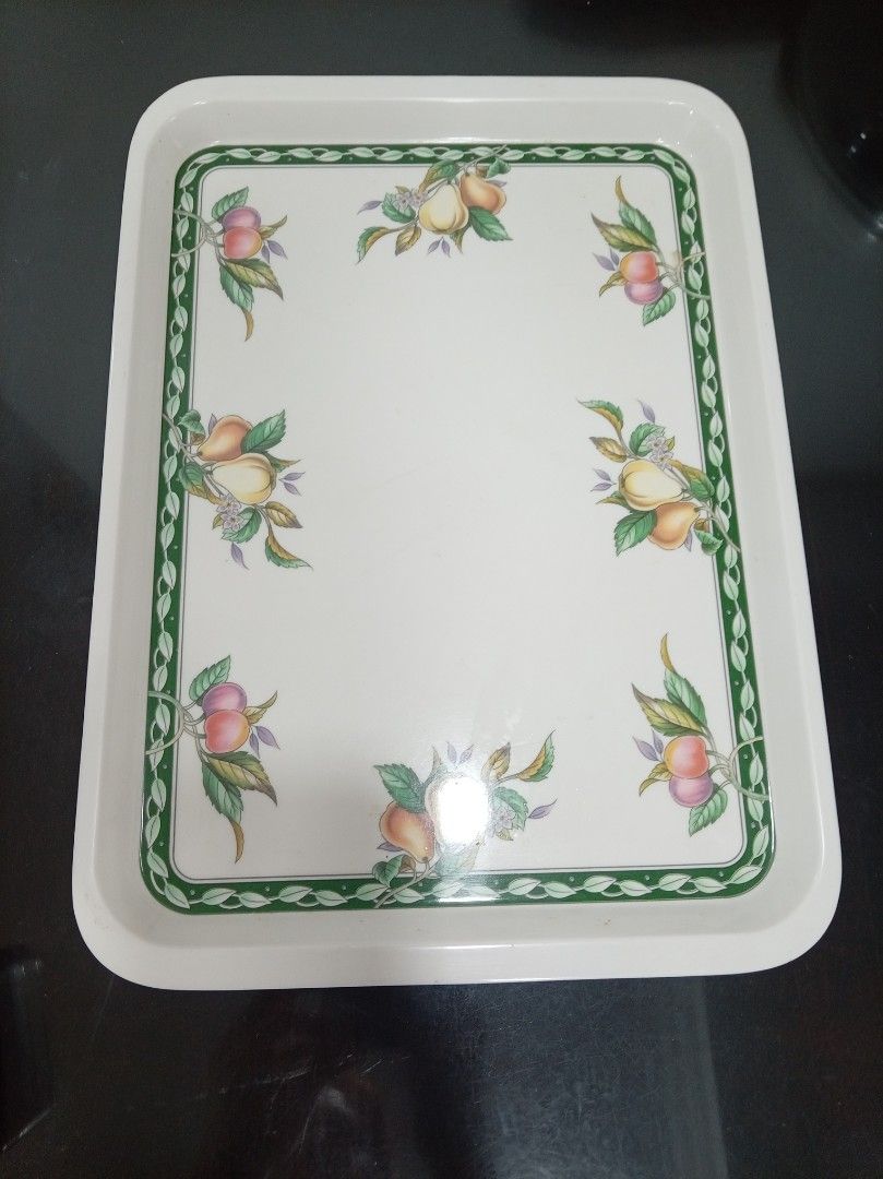 Rush Sale! Vintage Rectangular Serving Tray (Category: Other Kitchenware & Tableware) located in Makati City. Submitted by giovandbertha1 (Listing ID 1422947094, Image 1). Description: - Rectangular serving tray - White surface - Decorative green border with fruit illustrations - Rounded corners - Slightly raised edge - Durable material - Ideal for serving food or displaying items.