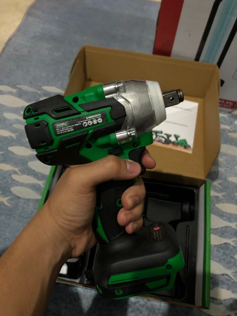 Ryoku 1/2" Drive Brushless Impact Wrench (Category: Construction Tools & Equipment) located in Pasay City. Submitted by sesi.g (Listing ID 1423025974, Image 2). Description: Ryoku 1/2" Drive Brushless Impact Wrench. Includes two 20V 2.6Ah batteries, charger, and manual. The impact wrench is green and black. The box indicates it is a cordless impact wrench. Model number is R-RBIW340-C2. makati location for pick up or delivery .
