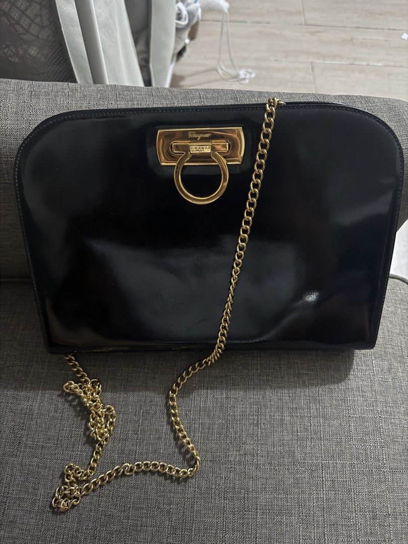 Salvatore Ferragamo Black Shoulder Bag (Category: Luxury Bags & Wallets) located in Makati City. Submitted by vanessacaeg_ (Listing ID 1423017643, Image 1). Description: - Salvatore Ferragamo shoulder bag - Black patent leather - Gold-tone chain strap and clasp - Chic and goes well with any outfit! .