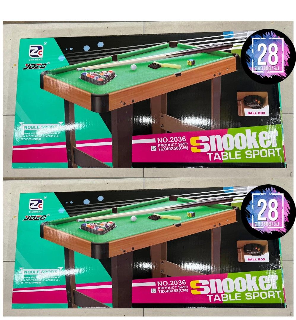 Snooker Table Sport (Category: Tables & Sets) located in Quezon City. Submitted by anghies_shop (Listing ID 1423003099, Image 2). Description: Mini snooker table with accessories. Includes a set of balls, two cues, and a triangle rack. The table has a green playing surface and a wooden frame. The dimensions are 76cm x 39.5cm x 57cm. The product size is 76x40x58cm..