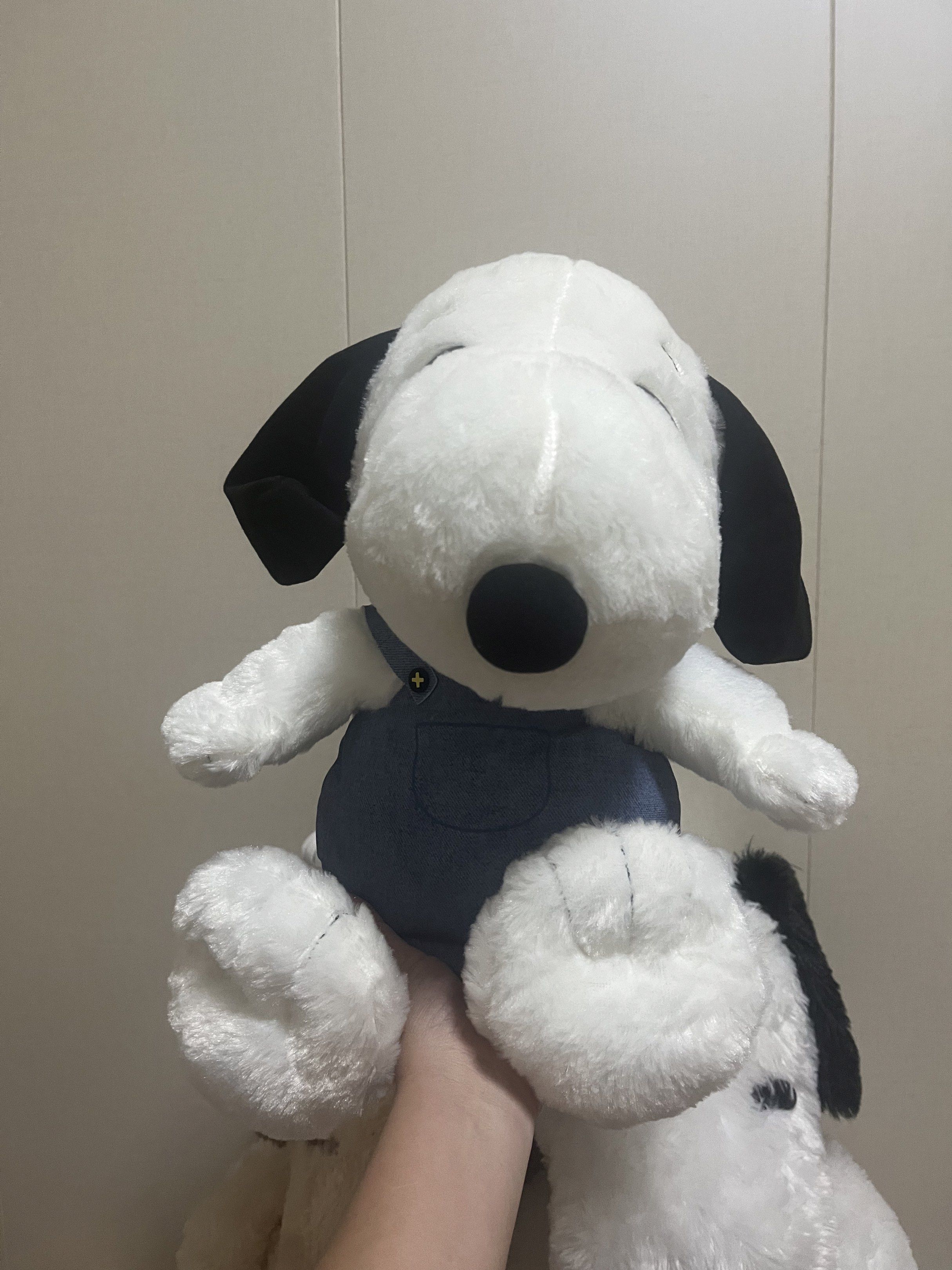 Snoopy Plush Toy with Overalls (Category: Plushies & Soft Toys) located in Las Pinas. Submitted by stuffhaven (Listing ID 1423074996, Image 1). Description: Location : Las Piñas Pick up or lalamove. No cod. Payment 1st. Super nice in actual. Adorable Snoopy plush toy is wearing denim overalls. It features Snoopy's signature black ears and nose. The toy has a red collar and a small tail. The tag indicates it is a Peanuts product..