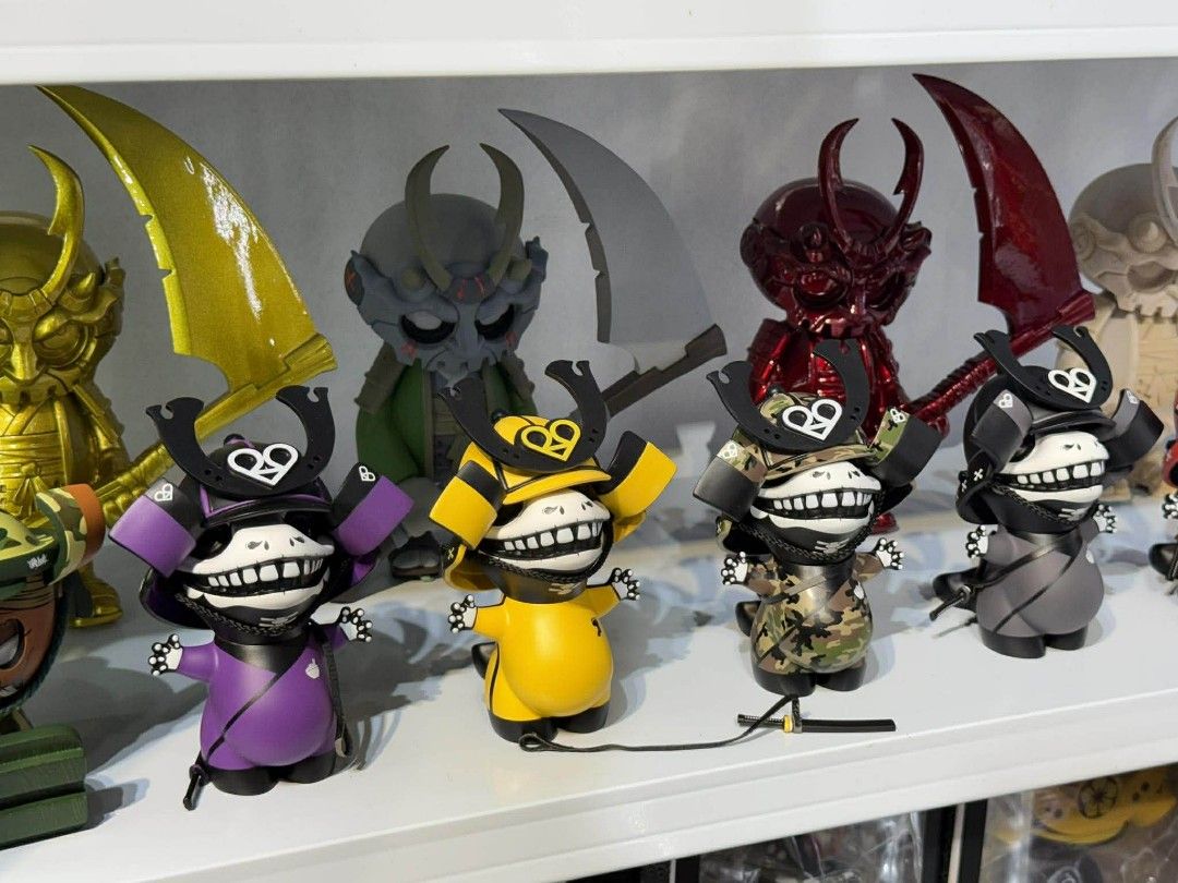 Solid Toys Samurai Figures (Category: Figurines & Statues) located in Manila. Submitted by erolljames50196 (Listing ID 1423064042, Image 2). Description: - Collection of Solid Toys Samurai figures. - Features various designs and unique color schemes. - Includes figures with samurai armor and helmets. - Some figures have a modern, stylized look. - Several figures are displayed with swords and other weapons. - A few figures have a skull-like appear