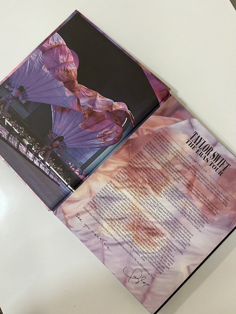 Taylor Swift The Eras Tour Book (Category: CDs & DVDs) located in Indang. Submitted by cyrelrdrgz_ (Listing ID 1422927562, Image 3). Description: - Official Taylor Swift The Eras Tour Book - Features stunning photos from the tour - Includes images from Lover, Fearless, and other eras - Contains a special message from Taylor Swift - Perfect for reliving the magic of the Eras Tour - Purchased via @glamourmerchph at Instagram.