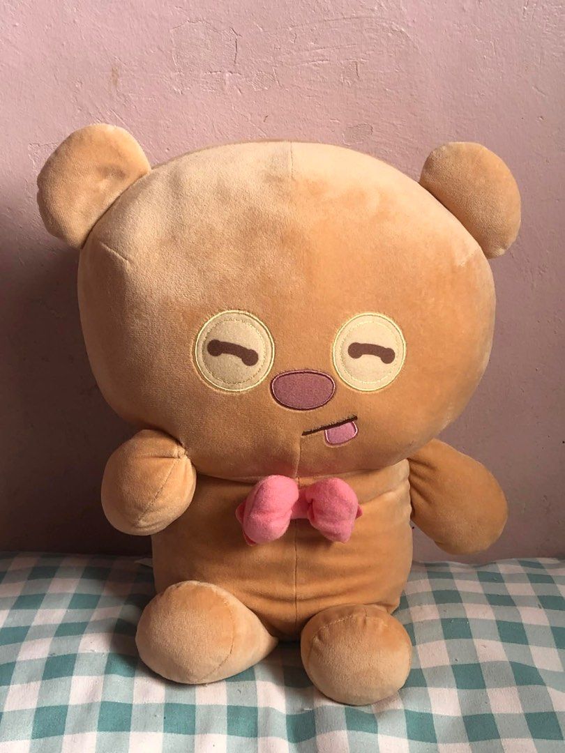 Tim Bear Brown Bear Plush Toy with Pink Bow (Category: Plushies & Soft Toys) located in Manila. Submitted by 102598iris (Listing ID 1422919101, Image 2). Description: - Cute brown bear plush toy - Features closed eyes and tongue sticking out - Adorned with a pink bow tie - Made of soft, plush material - Sitting down with a round body - Ideal cuddly companion.