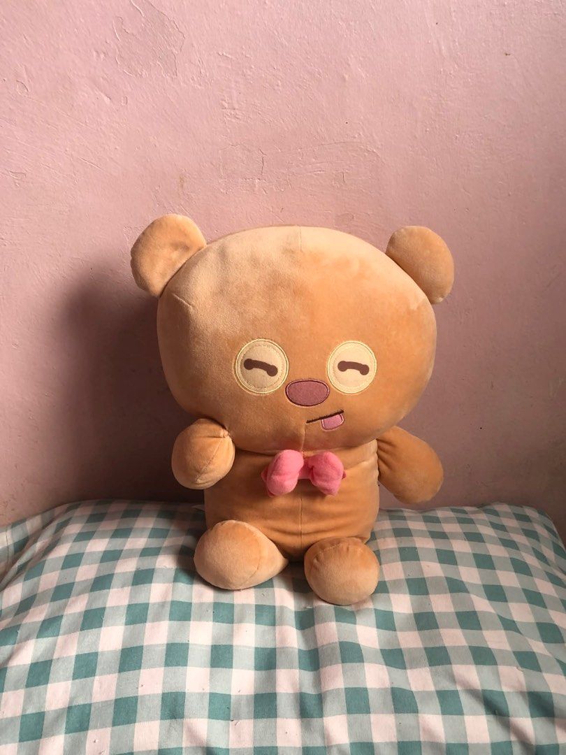 Tim Bear Brown Bear Plush Toy with Pink Bow (Category: Plushies & Soft Toys) located in Manila. Submitted by 102598iris (Listing ID 1422919101, Image 3). Description: - Cute brown bear plush toy - Features closed eyes and tongue sticking out - Adorned with a pink bow tie - Made of soft, plush material - Sitting down with a round body - Ideal cuddly companion.