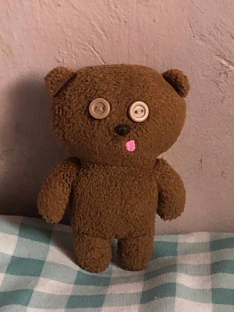 Tim Bear Brown Teddy Bear (Category: Plushies & Soft Toys) located in Manila. Submitted by 102598iris (Listing ID 1422913534, Image 1). Description: - Handmade teddy bear - Features button eyes and stitched pink tongue - Soft, brown fur-like texture - Includes a yellow scarf - Perfect for collectors or gifts.