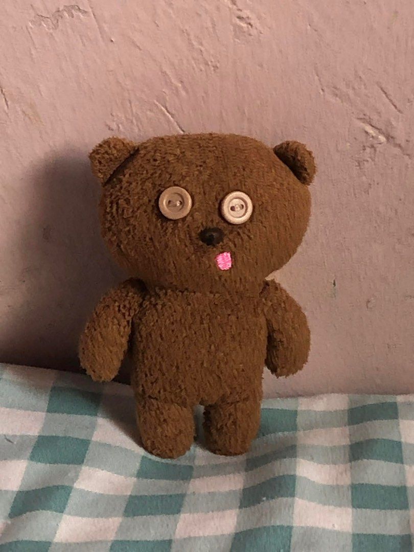 Tim Bear Brown Teddy Bear (Category: Plushies & Soft Toys) located in Manila. Submitted by 102598iris (Listing ID 1422913534, Image 2). Description: - Handmade teddy bear - Features button eyes and stitched pink tongue - Soft, brown fur-like texture - Includes a yellow scarf - Perfect for collectors or gifts.