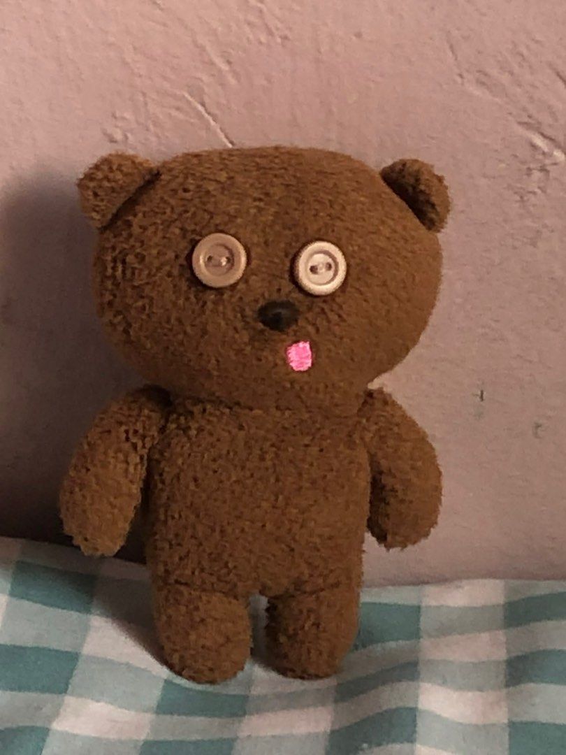 Tim Bear Brown Teddy Bear (Category: Plushies & Soft Toys) located in Manila. Submitted by 102598iris (Listing ID 1422913534, Image 3). Description: - Handmade teddy bear - Features button eyes and stitched pink tongue - Soft, brown fur-like texture - Includes a yellow scarf - Perfect for collectors or gifts.