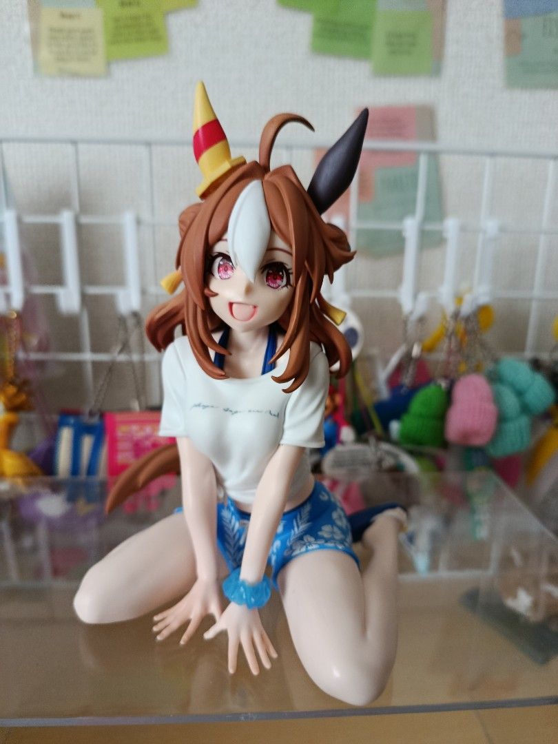 Uma Musume Pretty Derby Figure (Category: Figurines & Statues) located in Bacoor. Submitted by etcee.ph (Listing ID 1422925456, Image 3). Description: pink -SOLD - Uma Musume Pretty Derby figure - Relaxed pose - Outfit: White shirt, pink floral shorts, sandals - Hair: Brown with pink and purple accents - Features: Sitting on a clear base, includes tail.