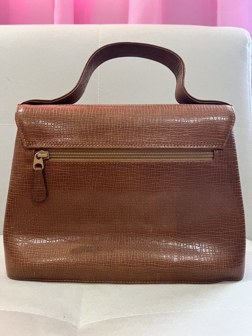 Ungaro Brown Handbag with Shoulder Strap (Category: Luxury Bags & Wallets) located in Dagupan City. Submitted by secondhandbyg (Listing ID 1422907297, Image 3). Description: Minor flaws see photos. Still looks beautiful. Final price posted. Just really need to declutter asap. MOP: GCash, GoTyme, Maribank MOD: JNT.