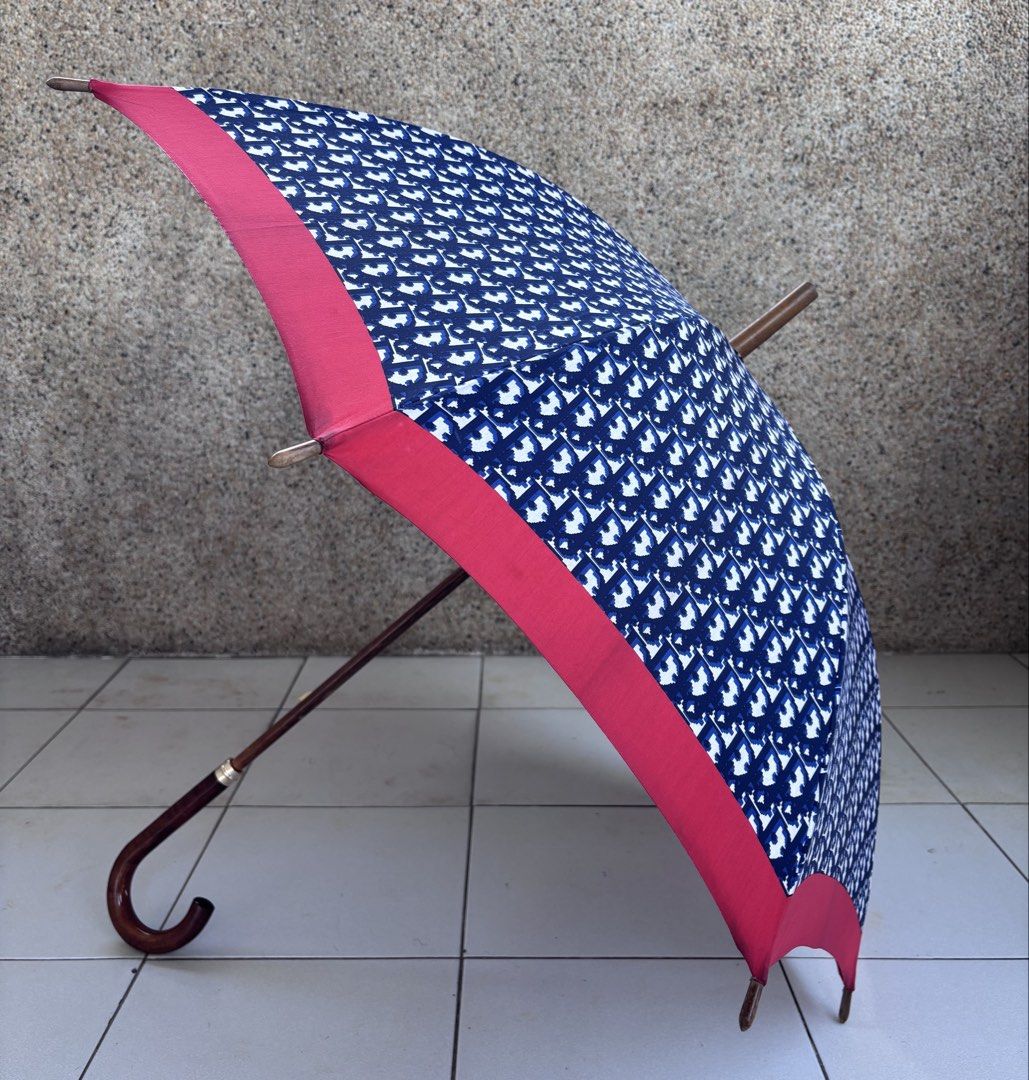 Vintage Dior Trotter Umbrella (Category: Umbrellas) located in Mabalacat. Submitted by pawcats (Listing ID 1423039174, Image 2). Description: - Vintage Dior Trotter Umbrella - Features the iconic Trotter pattern - Elegant design with red trim - A stylish accessory - Very Good Condition - No issue.