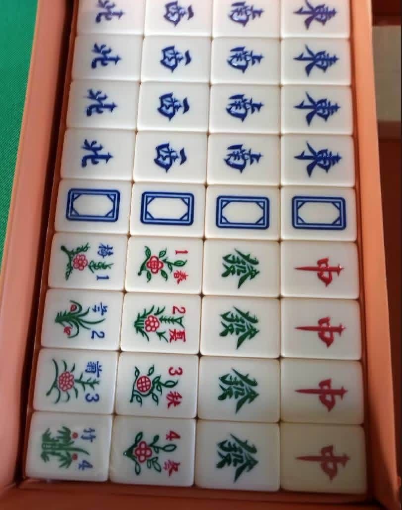 Vintage Mahjong Set with Case (Category: Board Games & Puzzles) located in San Pablo. Submitted by vennisa.sportssupplies (Listing ID 1422972490, Image 3). Description: - Complete vintage Mahjong set - Includes tiles, dice, and racks - Comes in a brown case - Features a handle and button closure - Tiles feature various symbols and characters - Full set of tiles included - Ready for play.