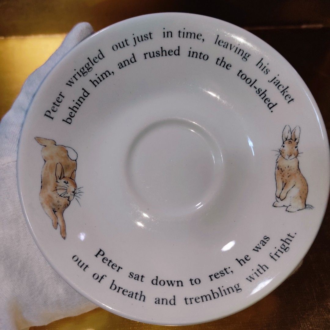 Wedgwood Peter Rabbit Saucer (Category: Coffee & Tea Tableware) located in Cainta. Submitted by fukunekojapansurplus (Listing ID 1423025453, Image 1). Description: Shallow Saucer 150 pesos no issue Wedgwood Peter Rabbit saucer. Features illustrations and text from the story. White, circular design, 10cm diameter. Made in England..