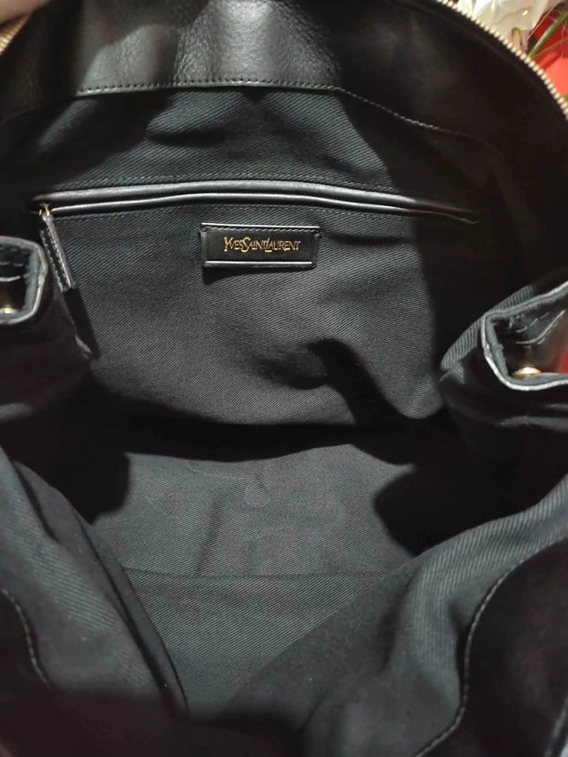 Yves Saint Laurent Black Leather Muse Two Bag (Category: Luxury Bags & Wallets) located in Cebu City. Submitted by tlisurplus (Listing ID 1422947628, Image 2). Description: - Black leather handbag - Gold-tone clasp and hardware - Top handle design - Secure zip closure - Interior pocket with YSL logo - Canvas lining - Made in Italy - Includes serial number.