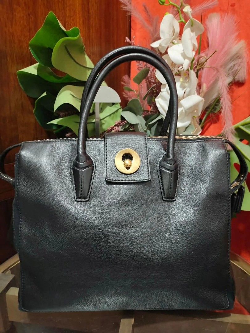 Yves Saint Laurent Black Leather Muse Two Bag (Category: Luxury Bags & Wallets) located in Cebu City. Submitted by tlisurplus (Listing ID 1422947628, Image 1). Description: - Black leather handbag - Gold-tone clasp and hardware - Top handle design - Secure zip closure - Interior pocket with YSL logo - Canvas lining - Made in Italy - Includes serial number.