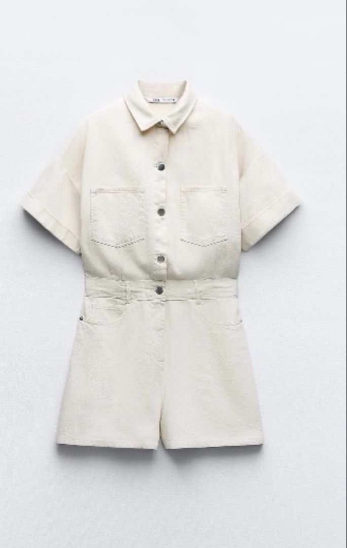 Zara Z1975 Denim Playsuit - Ecru (Category: Rompers) located in Makati City. Submitted by lheigg (Listing ID 1422967752, Image 1). Description: - Zara Z1975 denim playsuit - Color: Ecru - Size: Small - Features: - Collared neckline - Short sleeves - Button-down front - Two chest pockets - Waist tie - Perfect for a casual, stylish look..