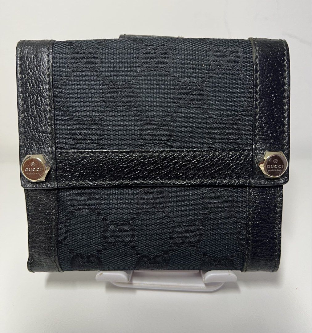 Authentic Gucci GG Black Bi-fold Wallet (Category: Luxury Bags & Wallets) located in Manila. Submitted by importgoodiesph (Listing ID 1423157990, Image 1). Description: Authentic Gucci Bifold Wallet - in excellent condition - classic black GG monogram canvas with black leather trim and a snap tab closure - 10 card slots, 1 coin purse and 2 note compartments - approx. dimensions (W4.5in, H4in, D0.75in) - made in Italy LBC shipping.