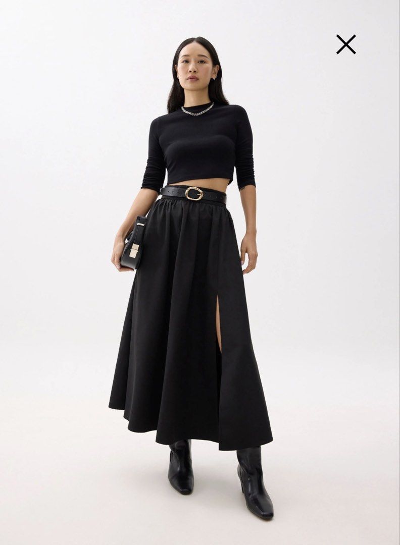 Black Slit Maxi Skirt XS (Category: Skirts) located in Cebu City. Submitted by nemesis13 (Listing ID 1423144932, Image 1). Description: - Black maxi skirt - High-waisted with side slit - Size: XS - Waist: 61-65cm - Hips: 86-90cm - Features two pockets - Solid, opaque fabric.