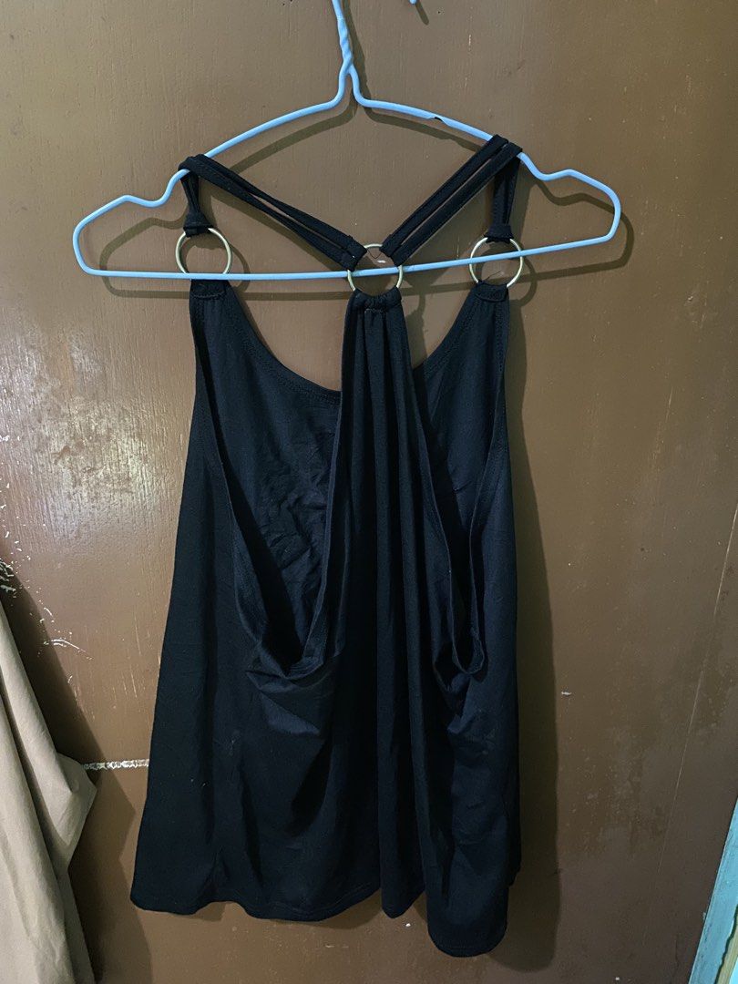 Black Tank Top with Graphic Print (Category: Sleeveless) located in Ozamiz City. Submitted by sw4gcvnt (Listing ID 1423238700, Image 2). Description: - Black tank top - Round neckline with ring details - Racerback style - Graphic print on front - Comfortable fabric - Plain black back - Stylish and versatile.