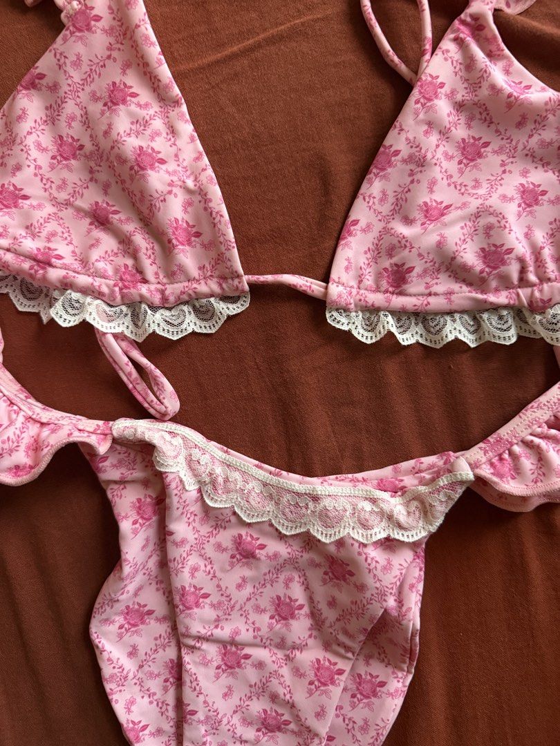 Blackbough Floral Pink Bikini Set (Category: Bikinis & Swimsuits) located in Mandaluyong City. Submitted by ndclutters (Listing ID 1423173631, Image 2). Description: - Blackbough bikini set - Pink floral print with lace trim - Includes triangle top with ruffle detailing and matching bottom - Size: Small.