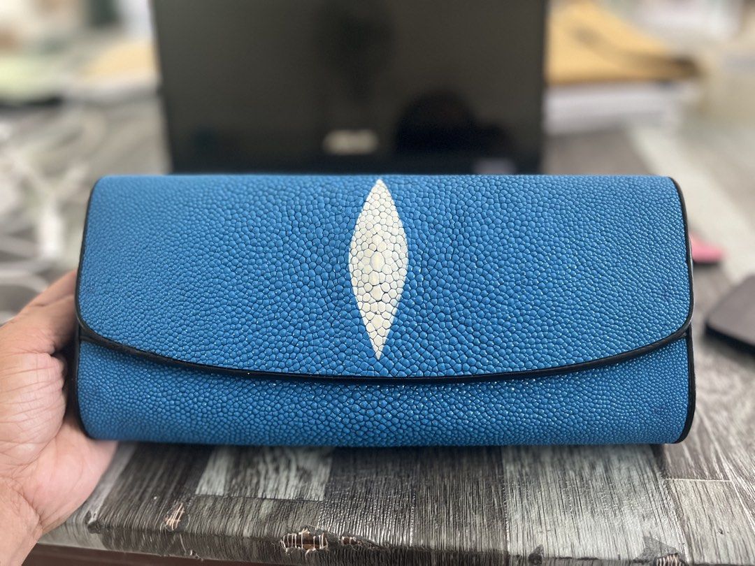 Blue Stingray Leather Clutch Bag (Category: Clutches) located in Daanbantayan. Submitted by christinet58475 (Listing ID 1423146588, Image 1). Description: - Blue stingray leather clutch bag - Unique white eye-shaped design - Black interior with zippered pocket and card slots - Detachable black strap for shoulder or crossbody wear - Suitable for casual and formal events.