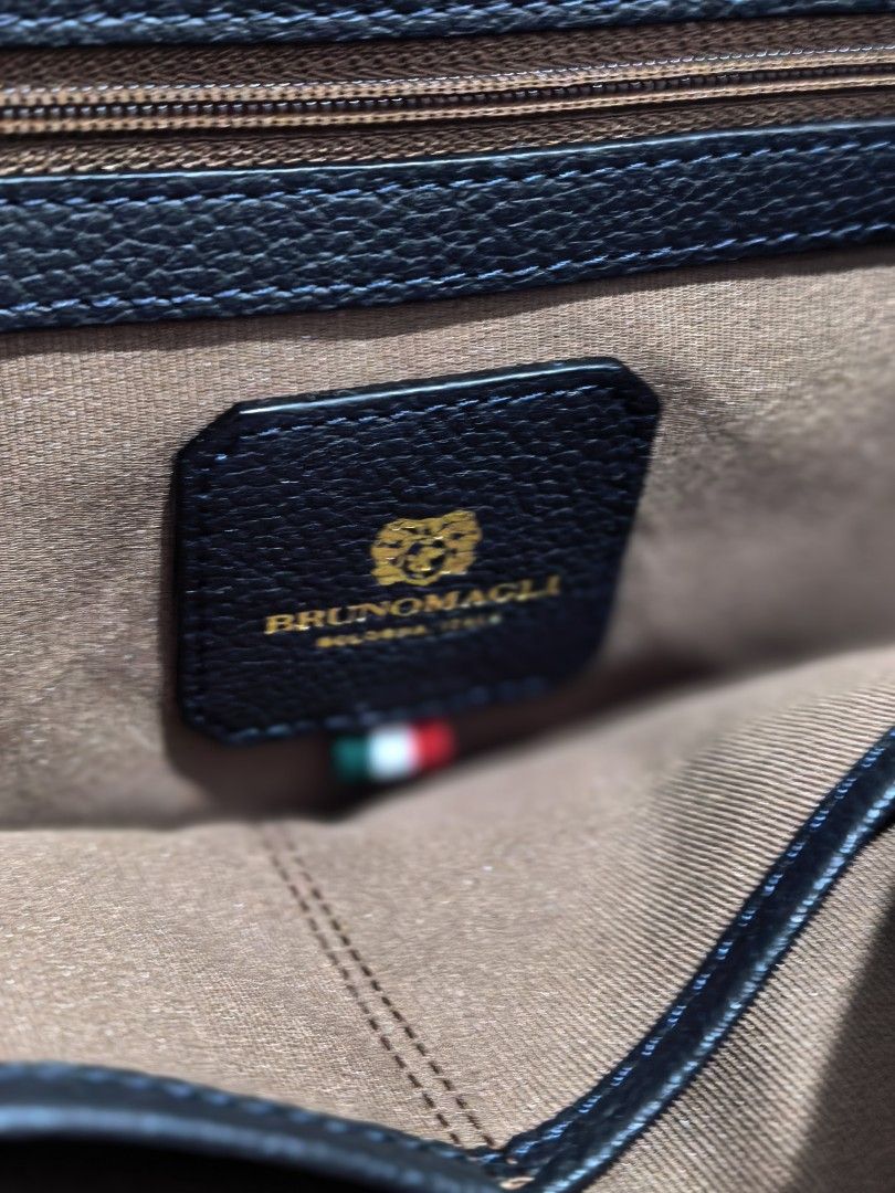 Bruno Magli Black Leather Handbag (Category: Luxury Bags & Wallets) located in Cagayan de Oro. Submitted by tommygurl1218 (Listing ID 1423172968, Image 2). Description: - Bruno Magli black leather handbag - Top handle design - Features tassel detail - Interior with branded leather tag and Italian flag - Made of high-quality leather - Includes dust bag.